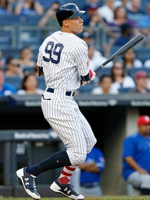 New York Yankees right fielder Aaron Judge watches a single against the Toronto Blue Jays during the first inning at Yankee Stadium.