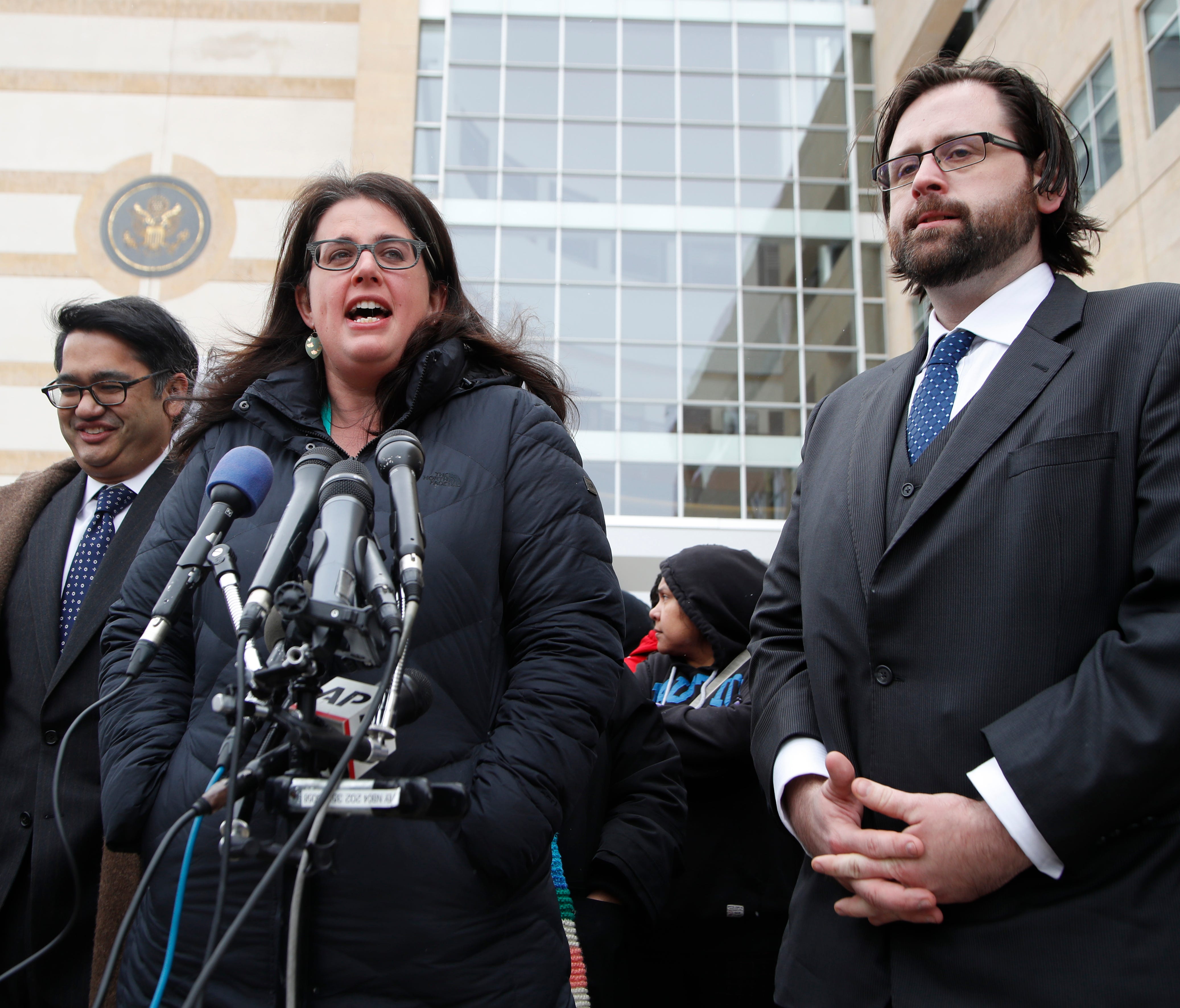 Becca Heller of the International Refugee Assistance Project speaks to reporters outside federal court in Beltsville, Md., on March 15, 2017, about a challenge to President Trump's revised travel ban.