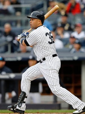 New York Yankees designated hitter Carlos Beltran hits a first-inning sacrifice fly that allowed Jacoby Ellsbury to score during a baseball game against the Chicago White Sox in New York, Sunday, May 15, 2016.