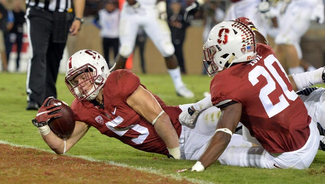 Oct 15, 2015; Stanford, CA, USA; Stanford Cardinal running back Christian McCaffrey (5) scores on a 9-yard touchdown run in the second quarter against the UCLA Bruins in a NCAA football game at Stanford Stadium. Mandatory Credit: Kirby Lee-USA TODAY Sports