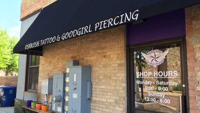 Oshkosh Tattoo and Good Girl Piercing moves into a new storefront at 233 High Ave. Tuesday.