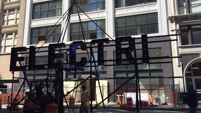 The "ElectriCity" sign is installed on the Martin Lofts.