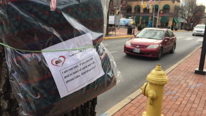 Packages of warm winter clothing were tied to posts in downtown York on Thursday.