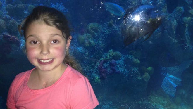 Marisa Tufaro pictured at the New England Aquarium in August 2014 a day before she became ill and was admitted to Boston Children's Hospital.