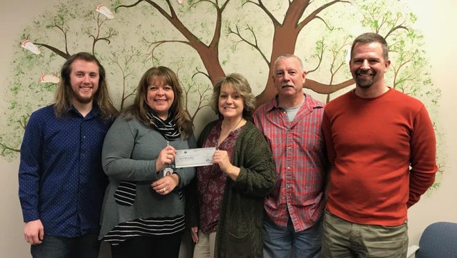 Restore Hope Band was featured at Charis Pregnancy Help Center's benefit concert. It raised $600 in money, as we all as $200 in baby items. Pictured are, from left: Hunter Chapin, Nancy Irizarry-Beachy, Maggie Wiesen of Charis Pregnancy Help Center, Russ Wiesen and Gene Olig.