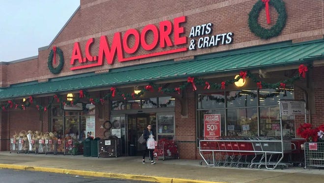 A shopper leaves a traditional A.C. Moore store in Mount Laurel. A smaller-format shop is to debut soon in Westmont.