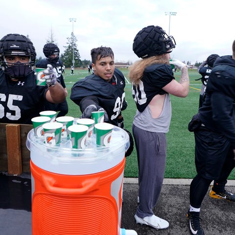 Pacific Lutheran football players help themselves 