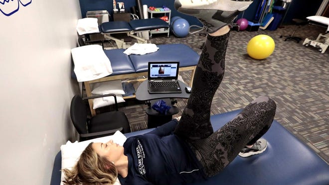 Physical therapist Marissa Gill uses Telehealth to connect with a client at Bay State Physical Therapy.