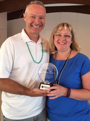 St. Lucie County Tax Collector Chris Craft presented Chief Deputy Georgia Rich with the Melanie Carter Exceptional Service Award at the office’s annual training day on April 12 at the River Walk Center in Fort Pierce.