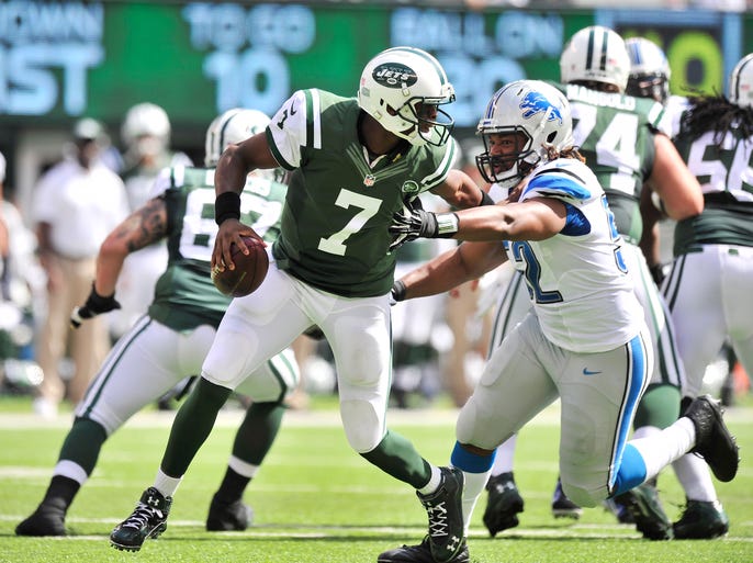 Jets quarterback Geno Smith can't get away from Lions Darryl Tapp who forces Smith to throw incomplete in the first quarter. Smith complete 17 of 33 passes for 209 yards, 1 touchdown and 1 interceptions for a QB rating of 68.9.