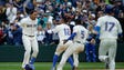 April 16: Mariners' Nelson Cruz is greeted by teammates