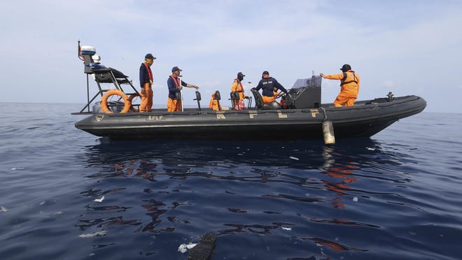 Rescuers conduct search operation in the waters of Ujung Karawang, West Java, Indonesia after a Lion Air plane crashed into the sea Monday, Oct. 29, 2018. A Lion Air flight crashed into the sea just minutes after taking off from Indonesia's capital on Monday in a blow to the country's aviation safety record after the lifting of bans on its airlines by the European Union and U.S. (AP Photo/Achmad Ibrahim)