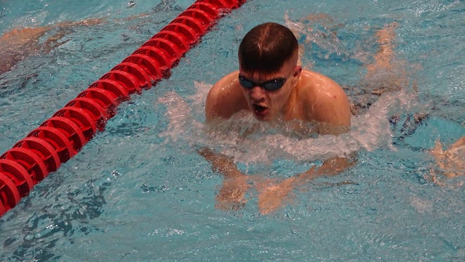 Granville Christian freshman C.J. Travis practices the breaststroke Nov. 30 at Denison.
