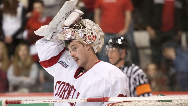 Andy Iles takes a break during a Cornell game in 2013.