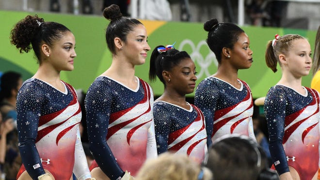 Team USA members Laurie Hernandez, Aly Raisman, Simone Biles, Gabby Douglas, and Madison Kocian before the women's team finals in the Rio 2016 Summer Olympic Games at Rio Olympic Arena.