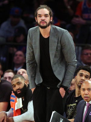 New York Knicks injured center Joakim Noah (13) watches from the bench during the fourth quarter against the Los Angeles Lakers at Madison Square Garden.