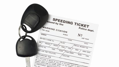 Stock image of a speeding ticket and a car key