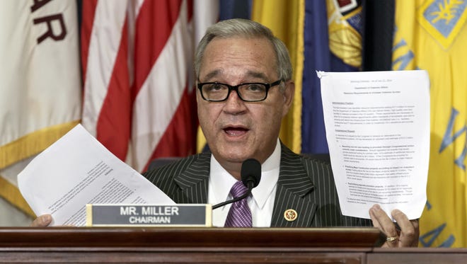 House Veterans Affairs Committee Chairman Jeff Miller, R-Fla., holds up two pages of resource requests from the Department of Veterans Affairs on Capitol Hill in Washington on July 24, 2014.
