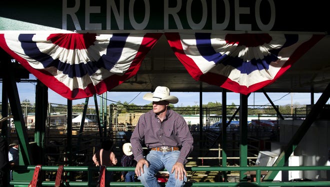 Cheyne Olney of Toppenish, Wash., waits for his turn to compete in the Reno Rodeo bareback bronc riding on Saturday at the Reno Rodeo Arena.