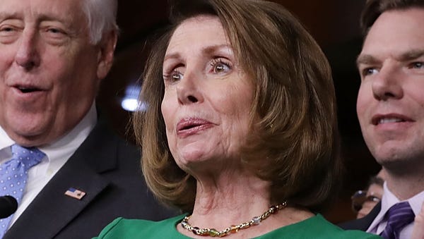 House Minority Leader Nancy Pelosi (D-CA) (C) is...