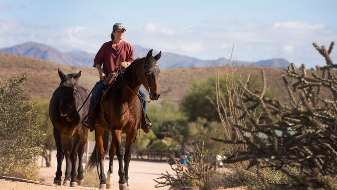 Peggy Vetter rides Bermuda Shorts while ponying Dodge at McDowell Mountain Regional Park on November 13, 2014.