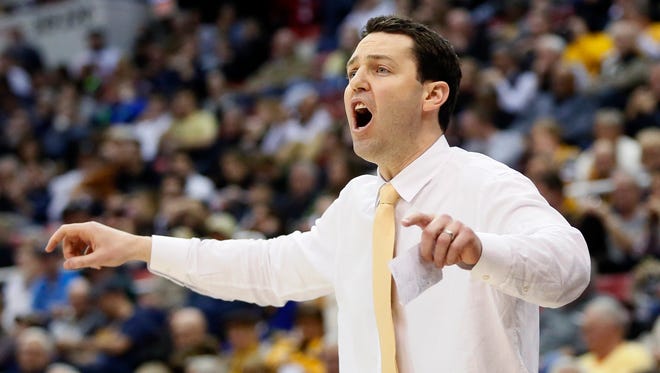 Valparaiso head coach Bryce Drew shouts instructions to his team during the second half of a NCAA college basketball game against Green Bay in the Horizon League tournament.