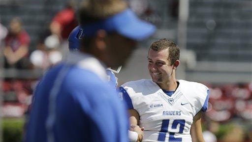 Middle Tennessee quarterback Brent Stockstill (12) laughs with his teammates before the game against Alabama Saturday in Tuscaloosa.