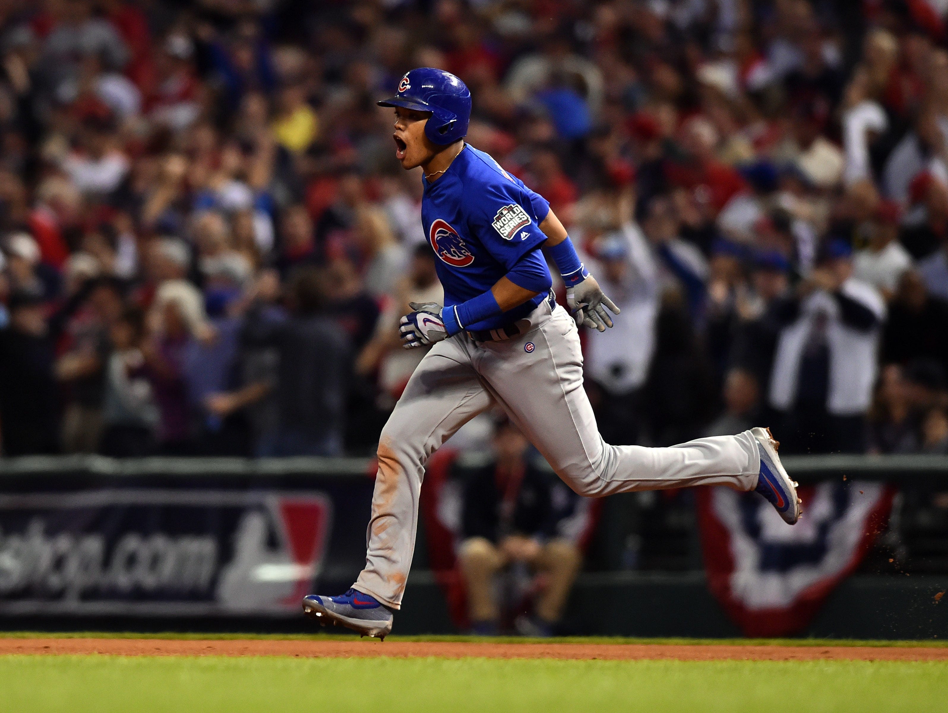 Chicago Cubs shortstop Addison Russell celebrates after hitting a grand slam against the Cleveland Indians in the third inning in game six of the 2016 World Series at Progressive Field in Cleveland.