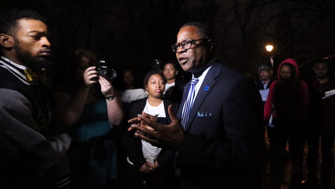 MTSU President Sidney McPhee, who is shown answering demonstrators' questions outside his home, will recommend that Forrest Hall be renamed to the Tennessee Board of Regents.