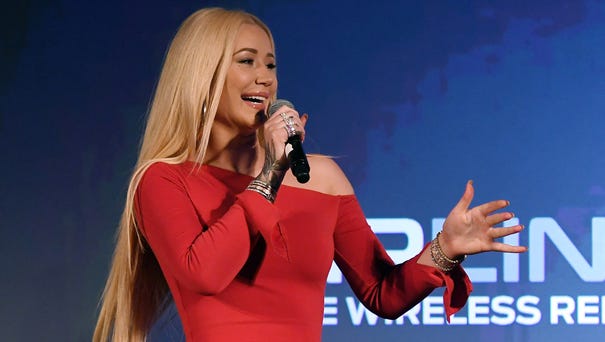 Rapper Iggy Azalea speaks during a Monster Inc....