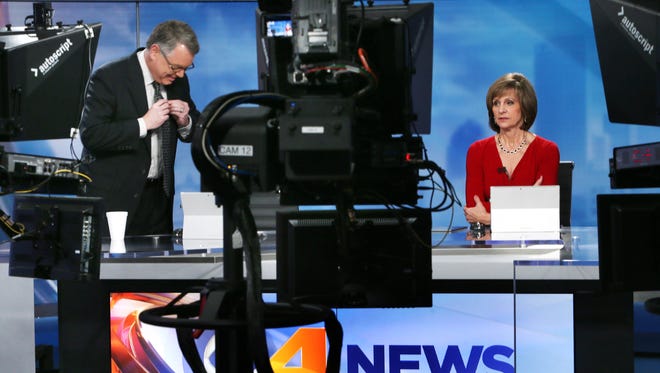 Bob Donaldson and Debby Knox wait for the start of an evening news broadcast rehearsal in the new WTTV-4 studio on Indianapolis' Northwestside on Tuesday, Dec. 30, 2014. On Jan. 1, 2015, WTTV-4 became the new CBS affiliate.