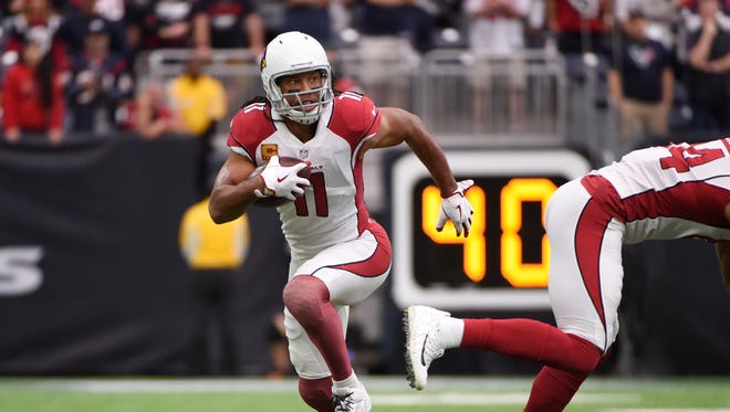 Arizona Cardinals wide receiver Larry Fitzgerald (11) runs after making a catch during the first half of an NFL football game against the Houston Texans, Sunday, Nov. 19, 2017, in Houston.