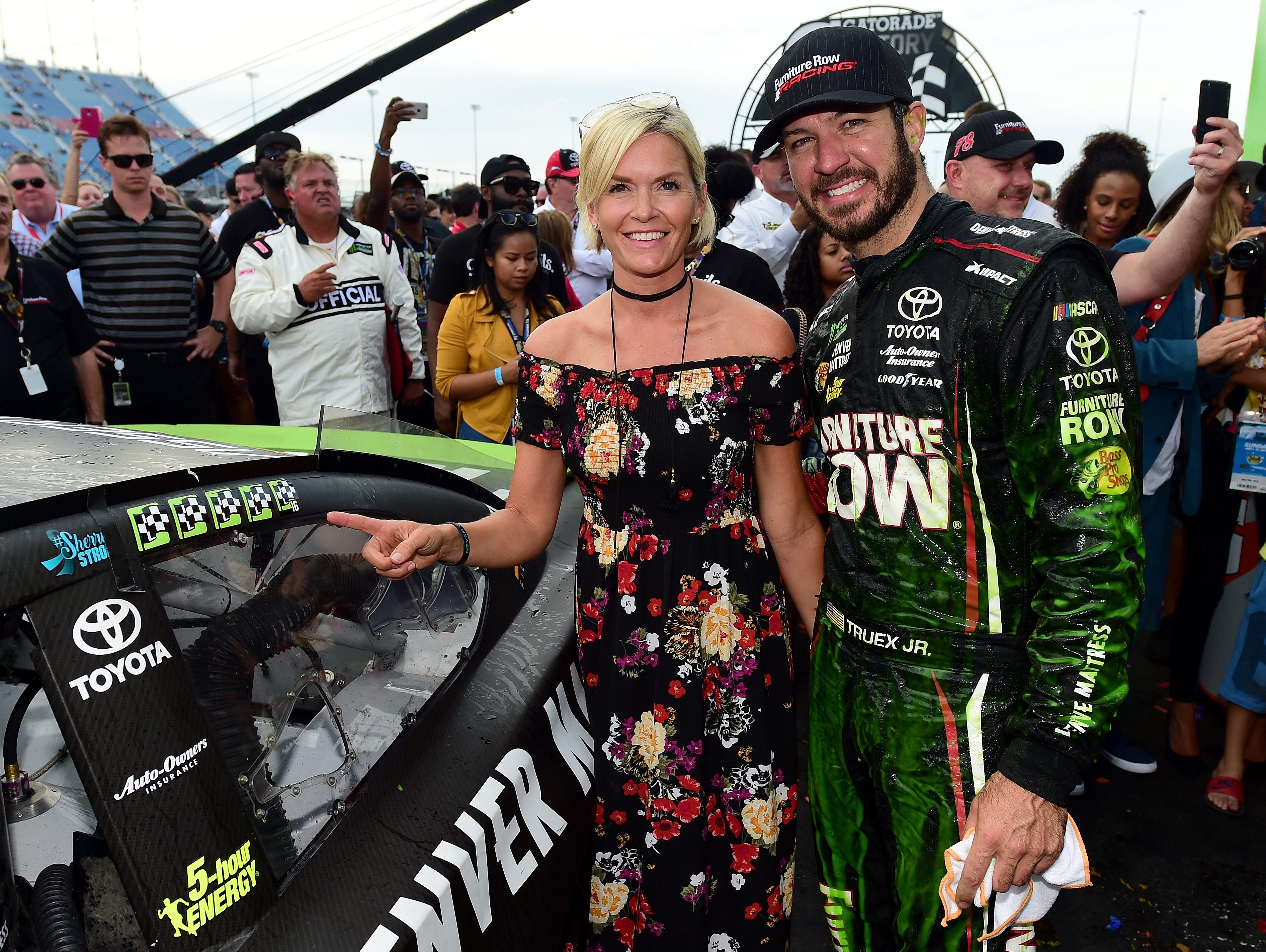 Martin Truex Jr. and Sherry Pollex celebrate in victory lane after he won at Chicagoland Speedway on Sept. 17 to open the playoffs and his run at a first championship.