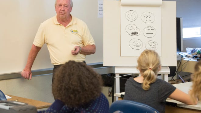 Jim Davis, the creator of Garfield, runs through a rudimentary drawing exercise to start off his arts class Monday night in the Arts and Journalism building. Davis is working as an artist in residence at Ball State teaching a graduate level drawing class.