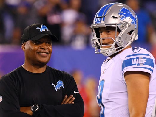 Lions coach Jim Caldwell with quarterback Matthew Stafford