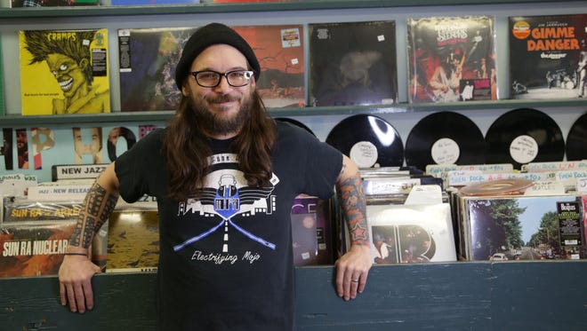 Aaron Anderson, the manager and one of the founders at his popular Street Corner Music in Oak Park, Michigan on Thursday, April 13, 2017.It is one of the classic and most well known and visited record stores in Metro Detroit.The store will be crowded with audiophiles looking for new and used vinyl records and CD's during Record Store Day on April 22nd.