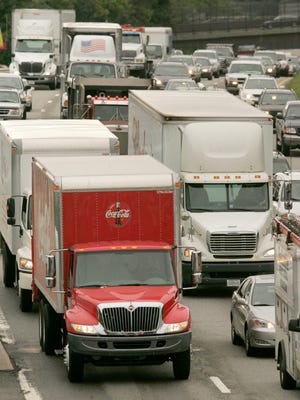 **CORRECTS ROAD TO ROUTE 95**Trucks and cars appear together in slow moving traffic on Interstate Route 95, in Newton, Mass., Friday, Aug. 10, 2007.  In the decade from 1995 to 2005, the weight load on urban highways increased 54 percent. (AP Photo/Steven Senne)