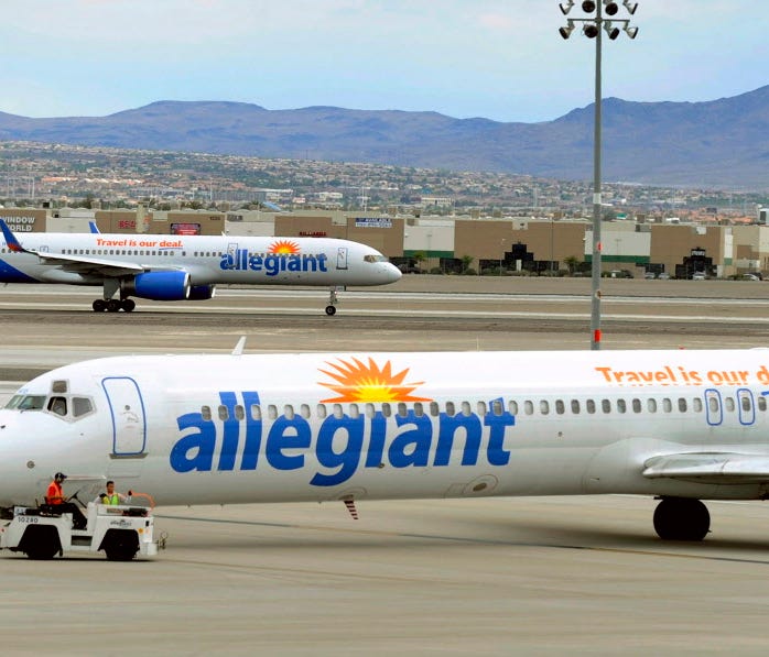 Two Allegiant Air jets taxi at McCarran International Airport in Las Vegas on My 9, 2013.