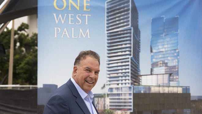 Billionaire developer Jeff Greene next to an artist rendering of One West Palm, a two-tower office/hotel/apartment/retail project at 550 Quadrille Blvd.