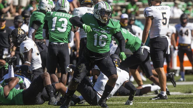 Marshall linebacker Brian Cavicante (16) celebrates after a stop as the Herd takes on Appalachian State on Saturday at Joan C. Edwards Stadium in Huntington, W.Va.