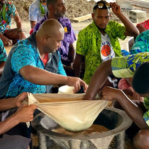 Men of the village prepare the kava during the sev