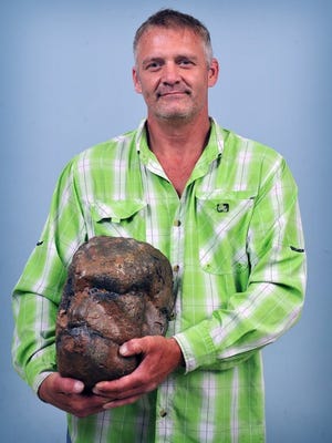 Todd May holds what he claims is a pretrified Bigfoot head that he discovered while searching for fossils in Ogden Canyon in Ogden, Utah.