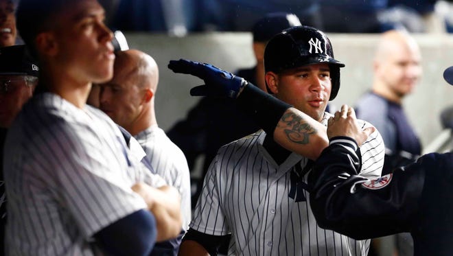 New York Yankees catcher Gary Sanchez (24) celebrates after hitting a home run in the seventh inning against the Minnesota Twins at Yankee Stadium.