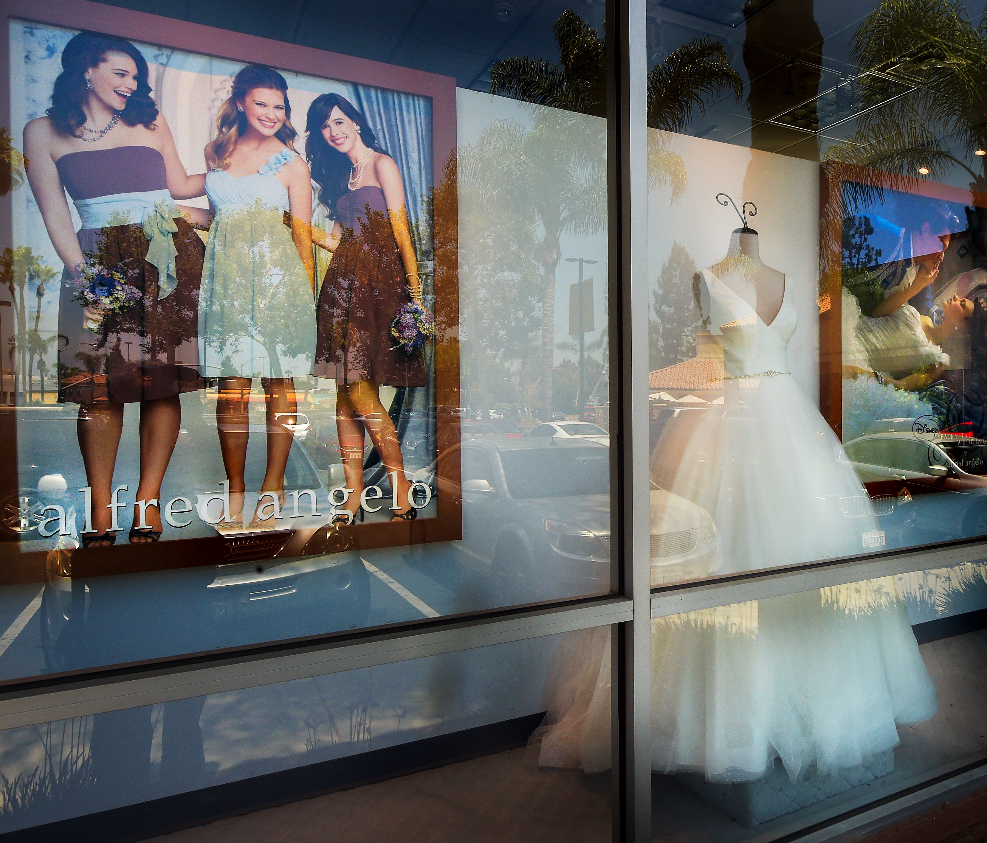 A window display is seen at Alfredo Angelo bridal store in West Covina, Calif., Friday, July 14, 2017. The wedding dress retailer declared bankruptcy late Thursday, July 13, and suddenly shut down all of its stores, leaving customers without answers 