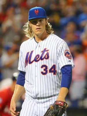 New York Mets starting pitcher Noah Syndergaard heads to the dugout during the eighth inning against the Washington Nationals at Citi Field on Aug. 2, 2015.