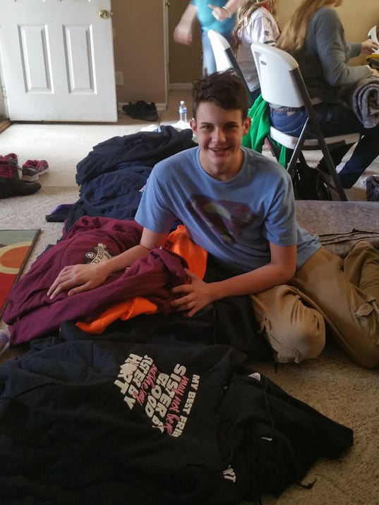 compassionate teen gives blankets to homeless