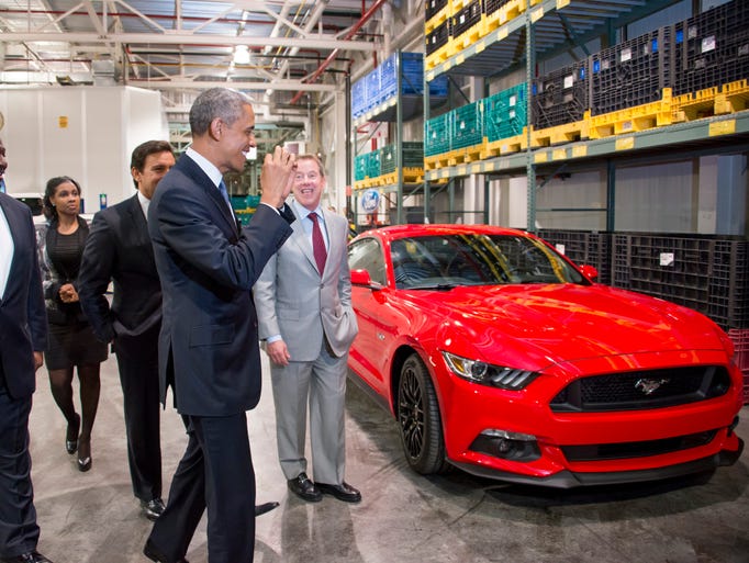 President Barack Obama reacts to seeing a 2015 Ford