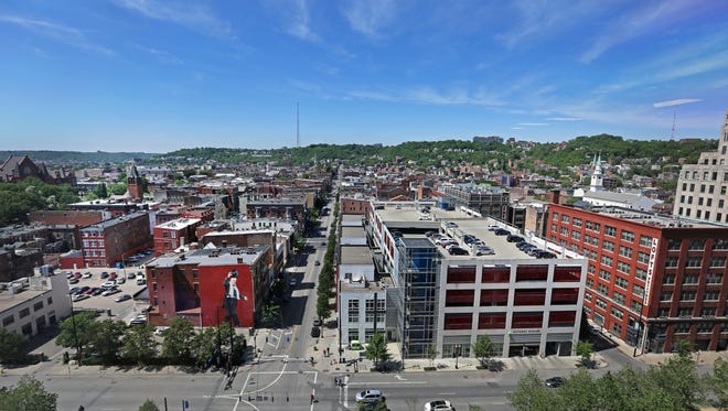 Tuesday, May 19, 2015
A view of Over-The-Rhine photographed from the Kroger building in downtown Cincinnati, looking straight up Vine Street. 
The Enquirer/ Liz Dufour