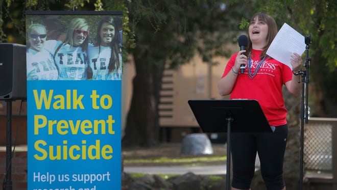Allie Rubinowitz, who lost her father to suicide three years ago, shares her story before the start of the 2017 Out of the Darkness Campus Walk at California Lutheran University. The event in Thousand Oaks was held to raise funds for suicide prevention.