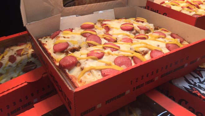 The coney dog deep dish pizza by Little Caesars will be served at Comerica Park during the 2017 season. The park's staff showed off its new food options for Detroit Tigers games on March 30, 2017.